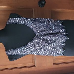 Grey vest with sequins and button down front.